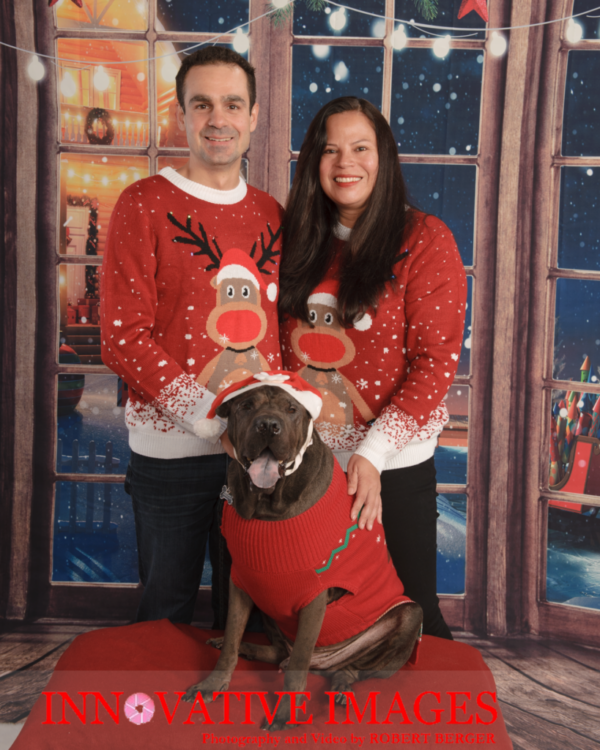 Christmas portrait of a couple dressed for their Houston TX photo session at Innovative Images Photography by Robert. The photo studio offers mini sessions and full portrait sessions by appointment. Avoid long lines and traffic at the mall. Christmas portraits sessions are life long memories for families, kids, pets and couples. Call 281.531.5269 for an appointment.